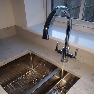 kitchen tap with hot and cold water supplies