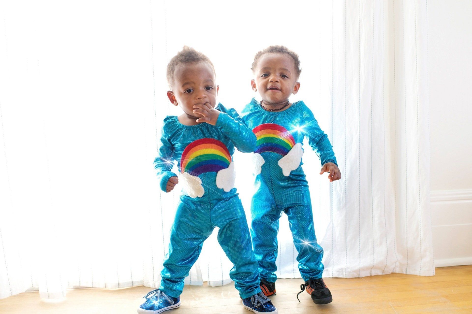 Toddlers in rainbow costumes. Image: Frank McKenna via Unsplash