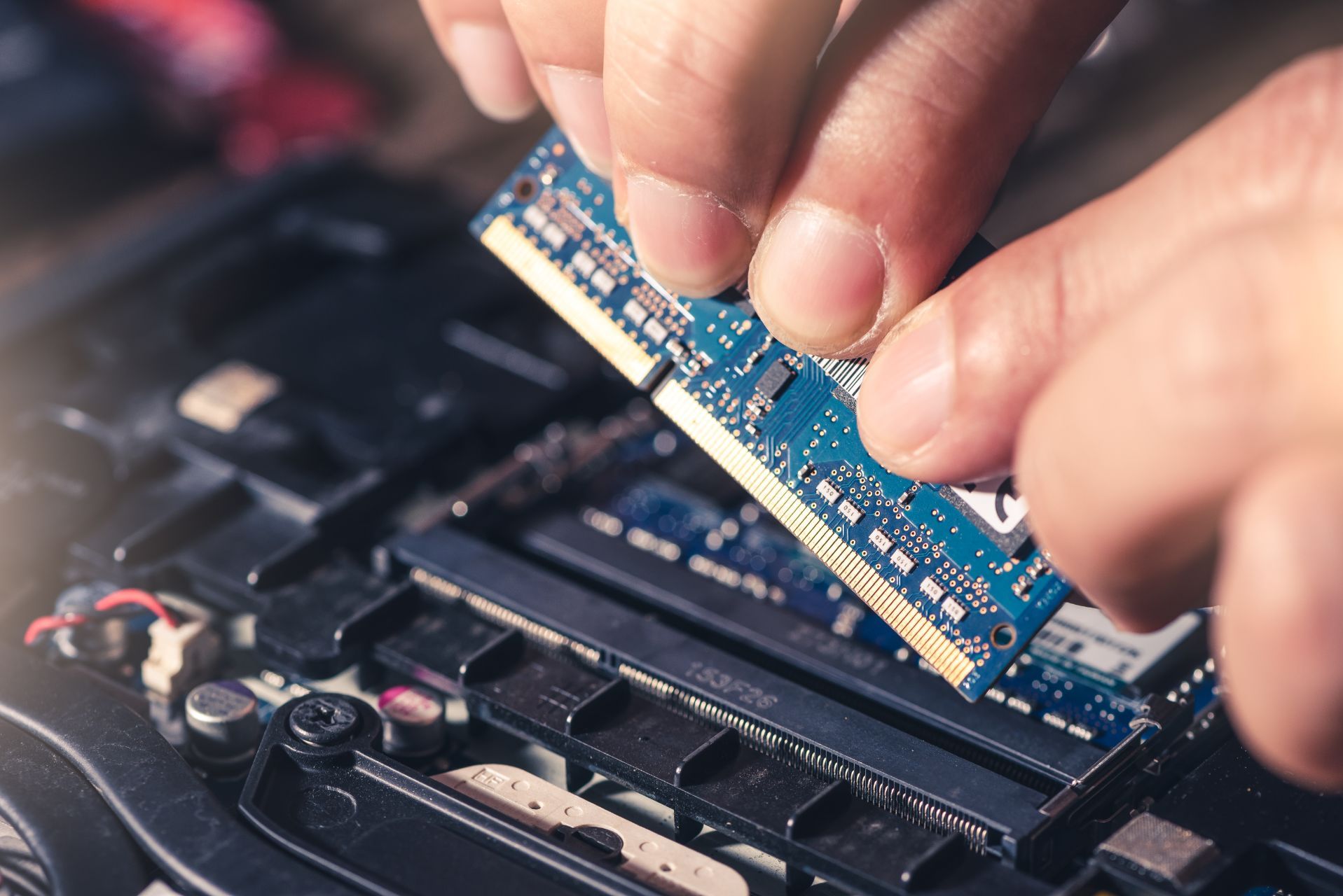 a person working on a computer hard drive