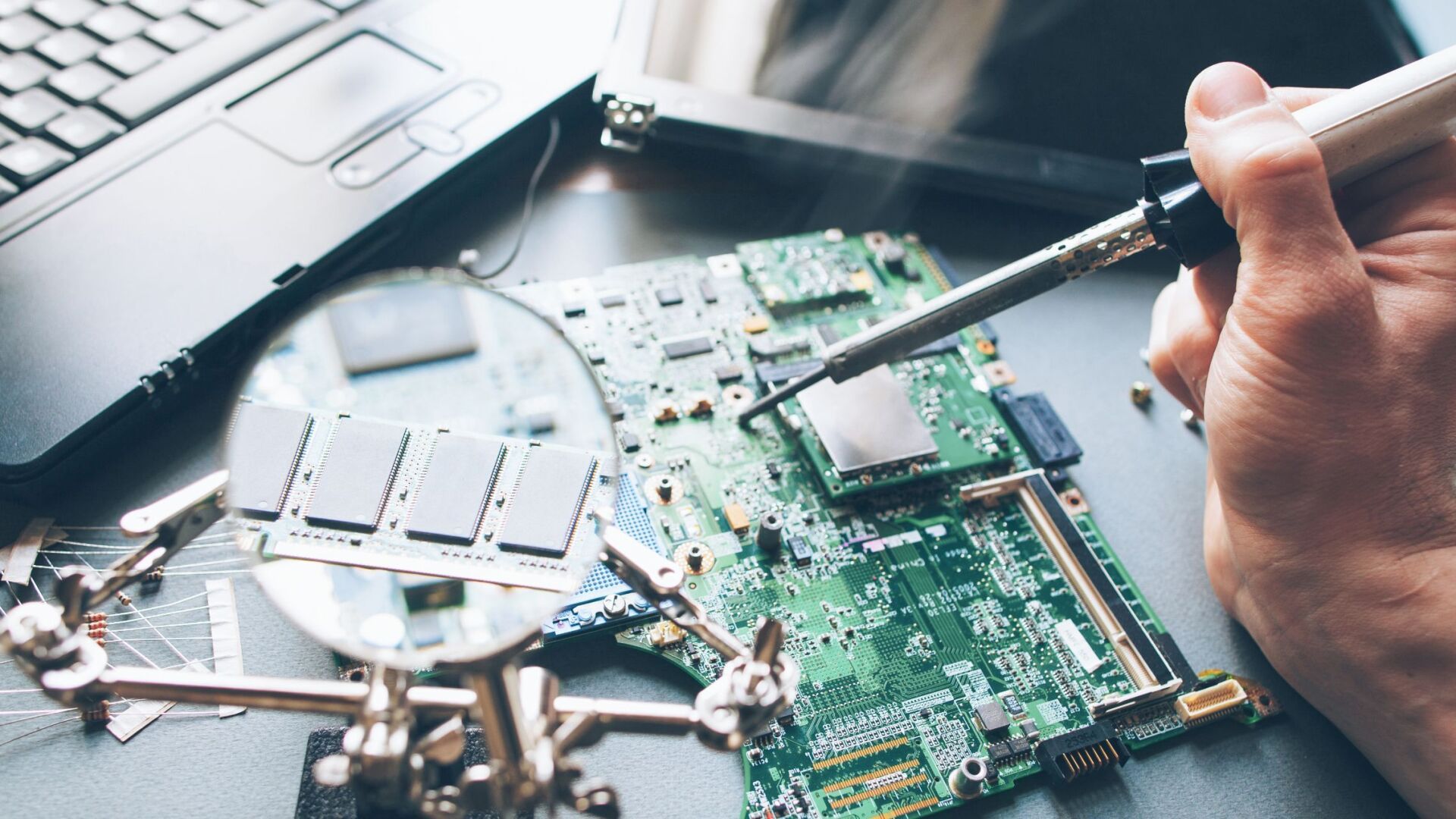a person working on a computer hard drive