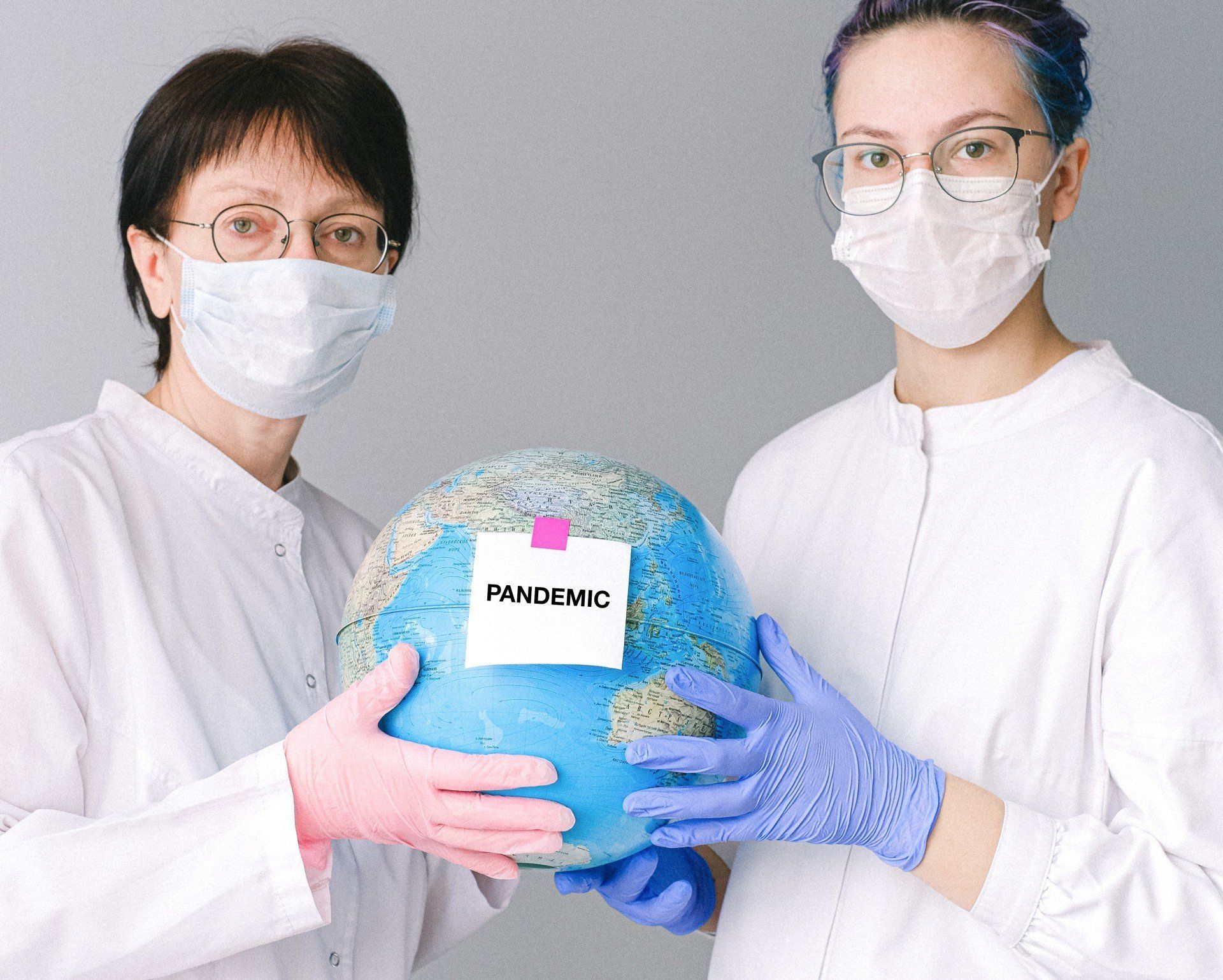 Name: people-with-face-masks-and-latex-gloves-holding-a-globe-4167561-15b89b83-1920w.jpg