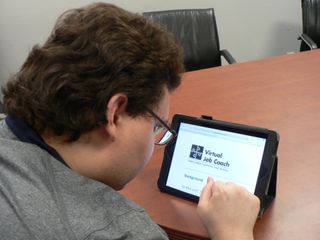 Photo of person using Virtual Job Coach on an iPad