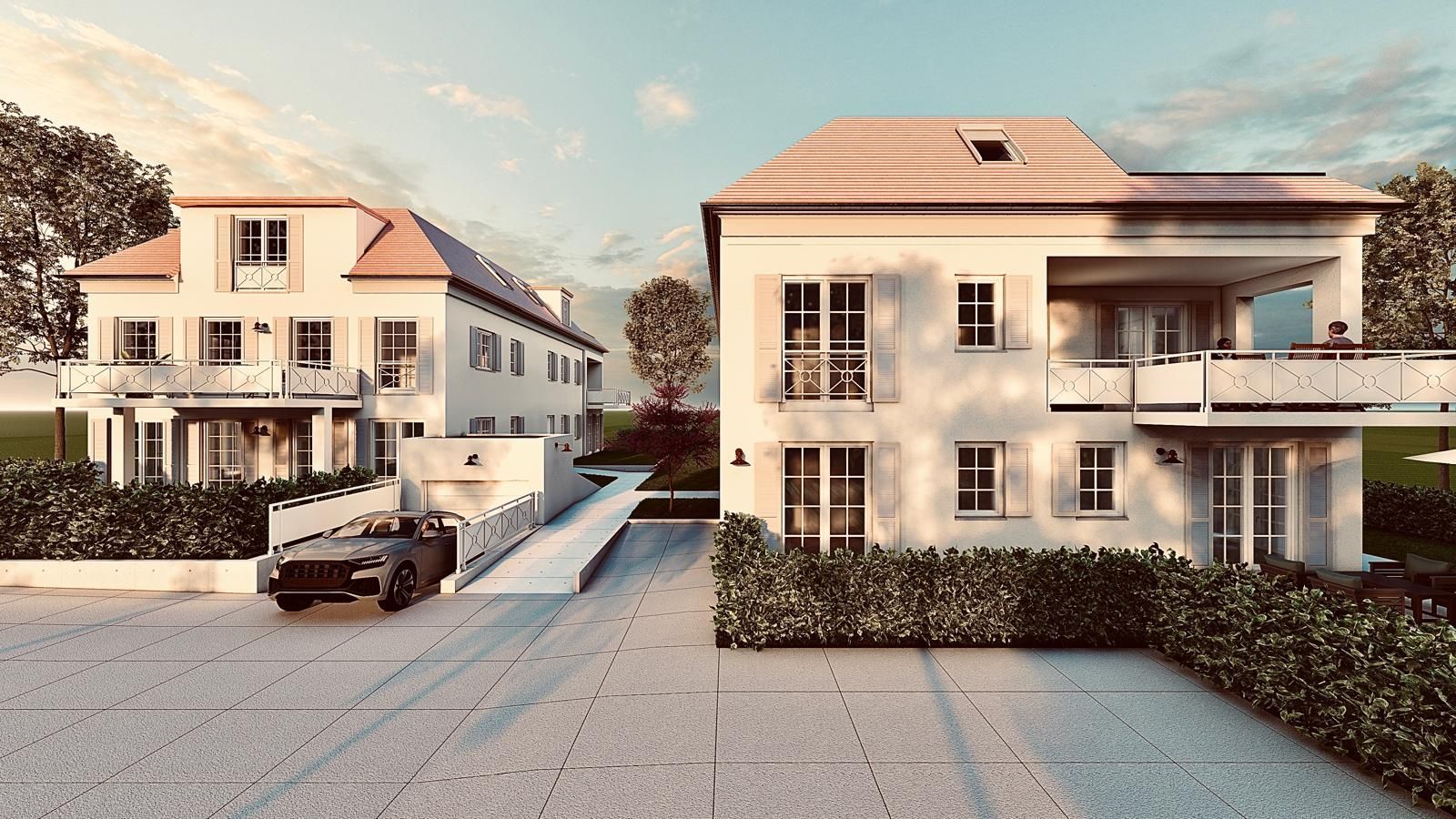 Zweistöckige, helle Häuser mit roten Ziegeldächern, unter sonnigem Himmel.