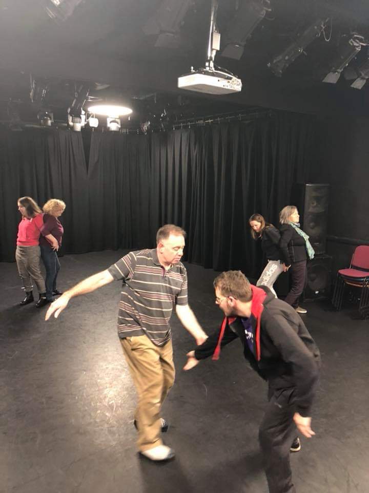 Anthony and Michael in image foreground using touch to guide movement