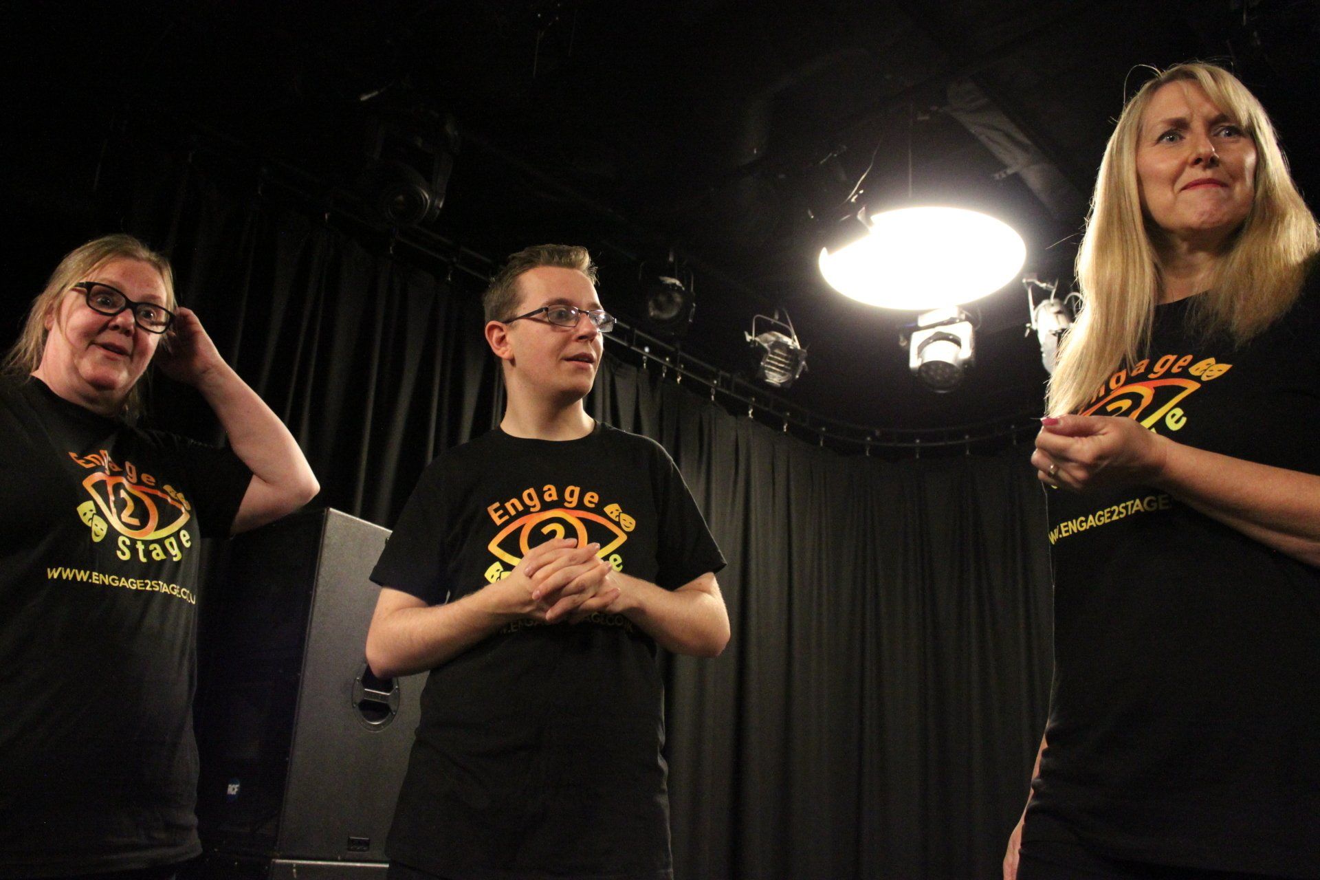 Elizabeth, Anthony and Tracey standing in row in the studio
