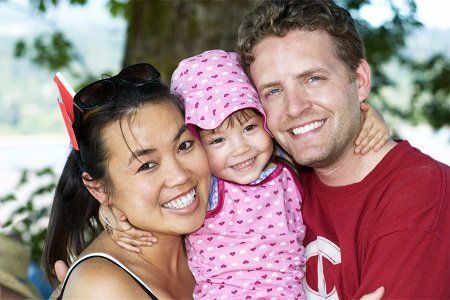 Asian-White American couple with baby