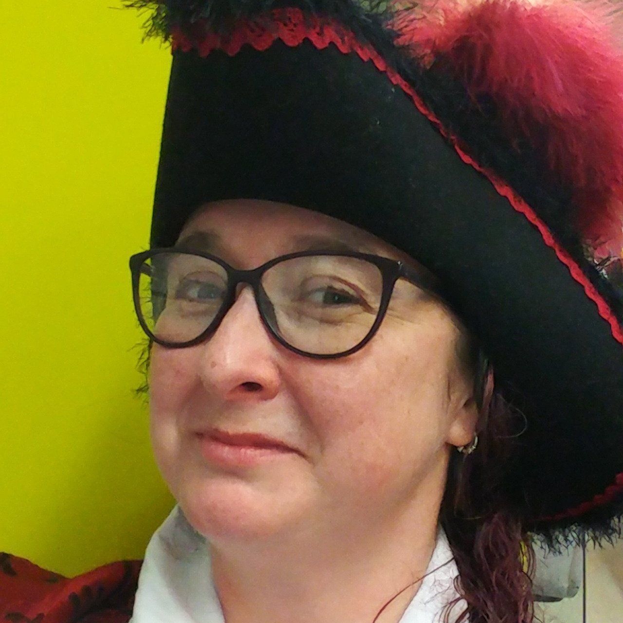 Jasmine Fox, cosplaying as a pirate, wearing black and red