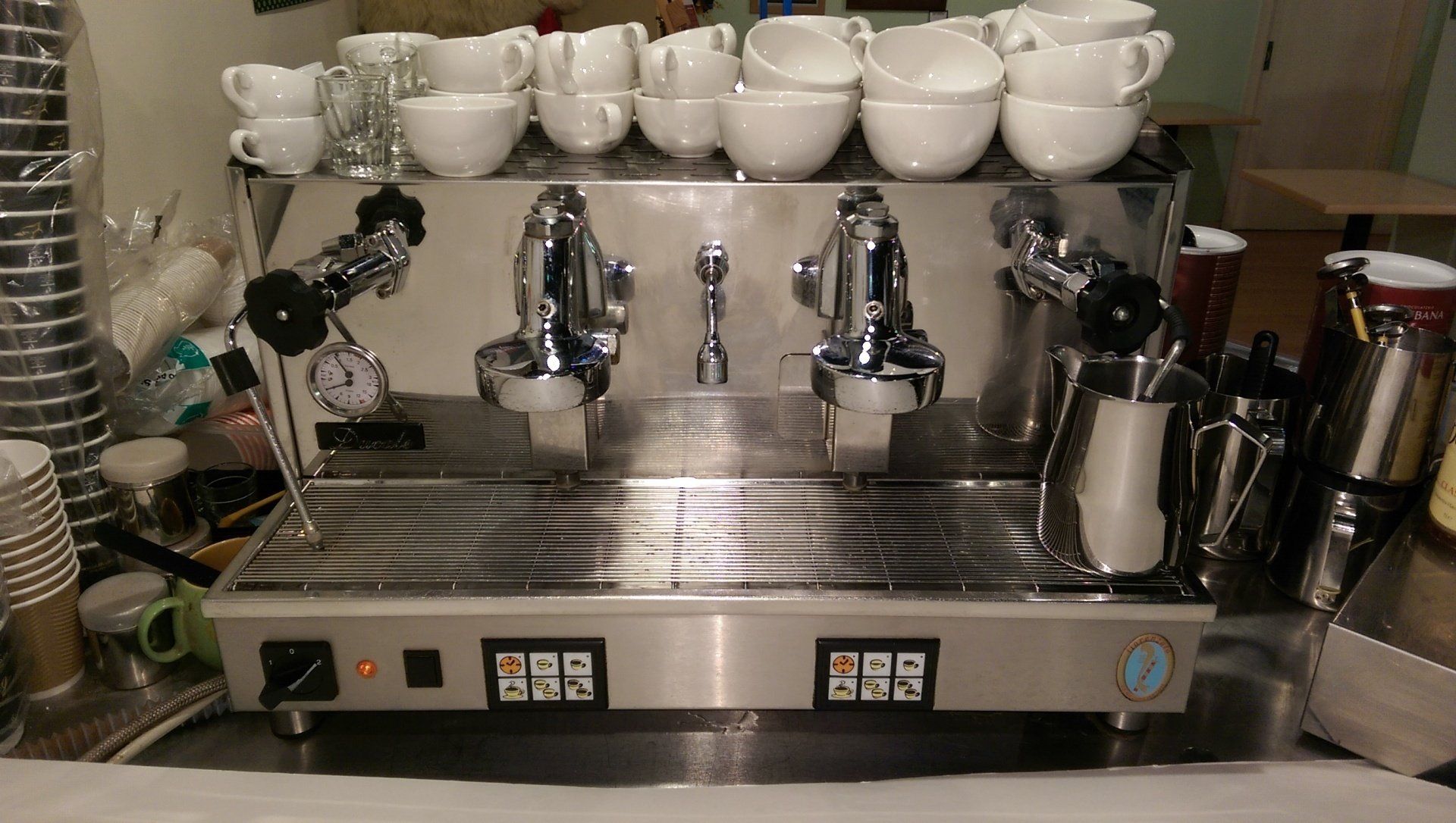 A 2 group espresso machine in a busy coffee shop