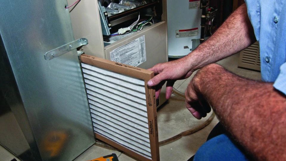 Man changing an air filter 