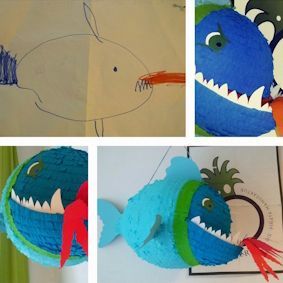 Die Fischzeichnung eines Kindes wurde in eine farbenfrohe Pappmaché-Piñata mit blauen, roten und grünen Akzenten verwandelt.