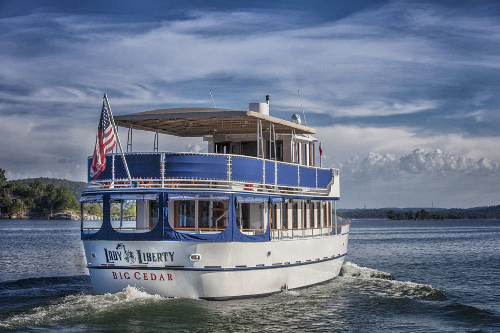 Photo of a small ferry boat cruising the lake.