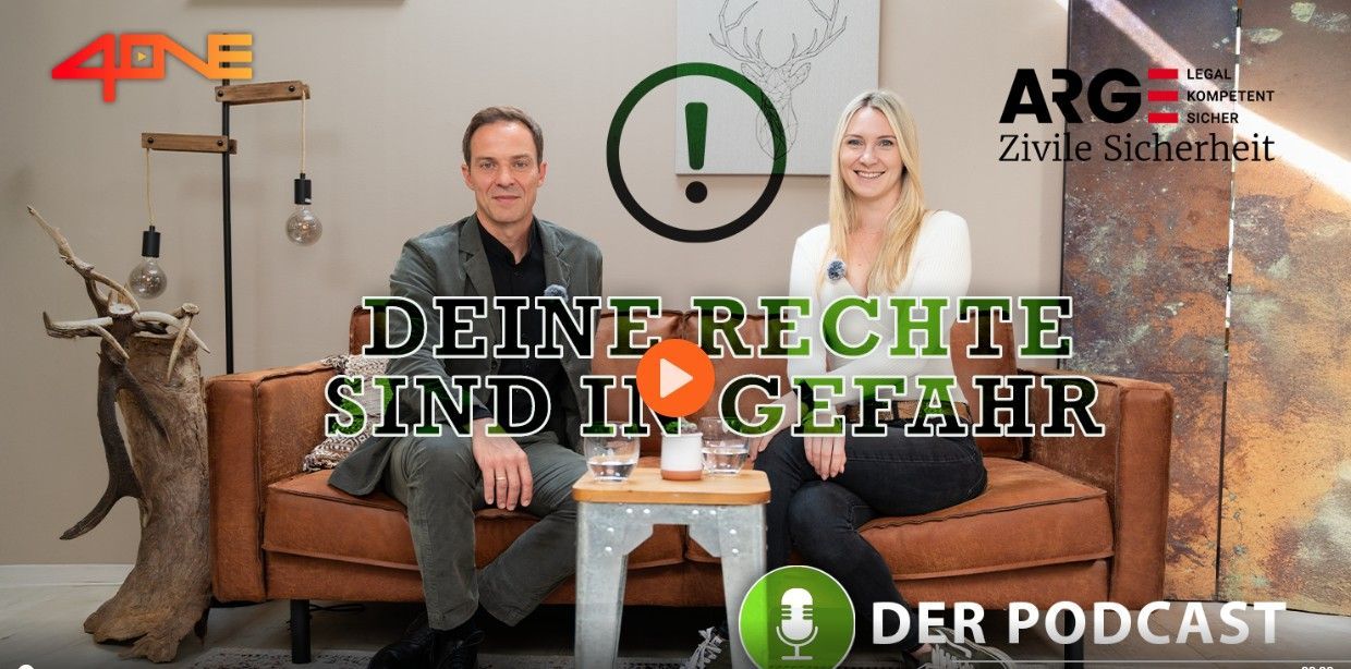 Two people sit on a brown sofa for a podcast episode titled 