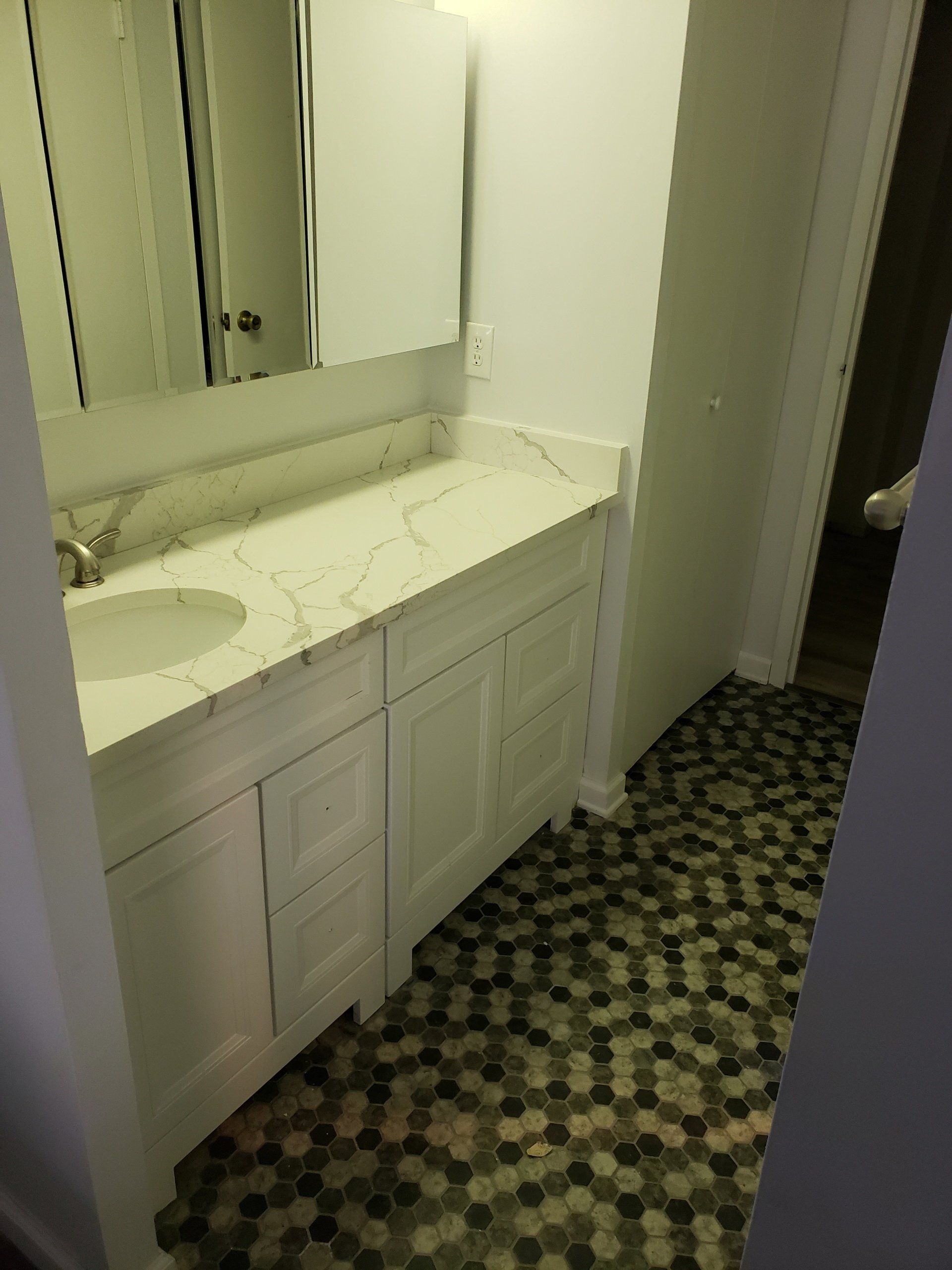 Jenkintown condo bathroom remodel vanity and floor tiles.