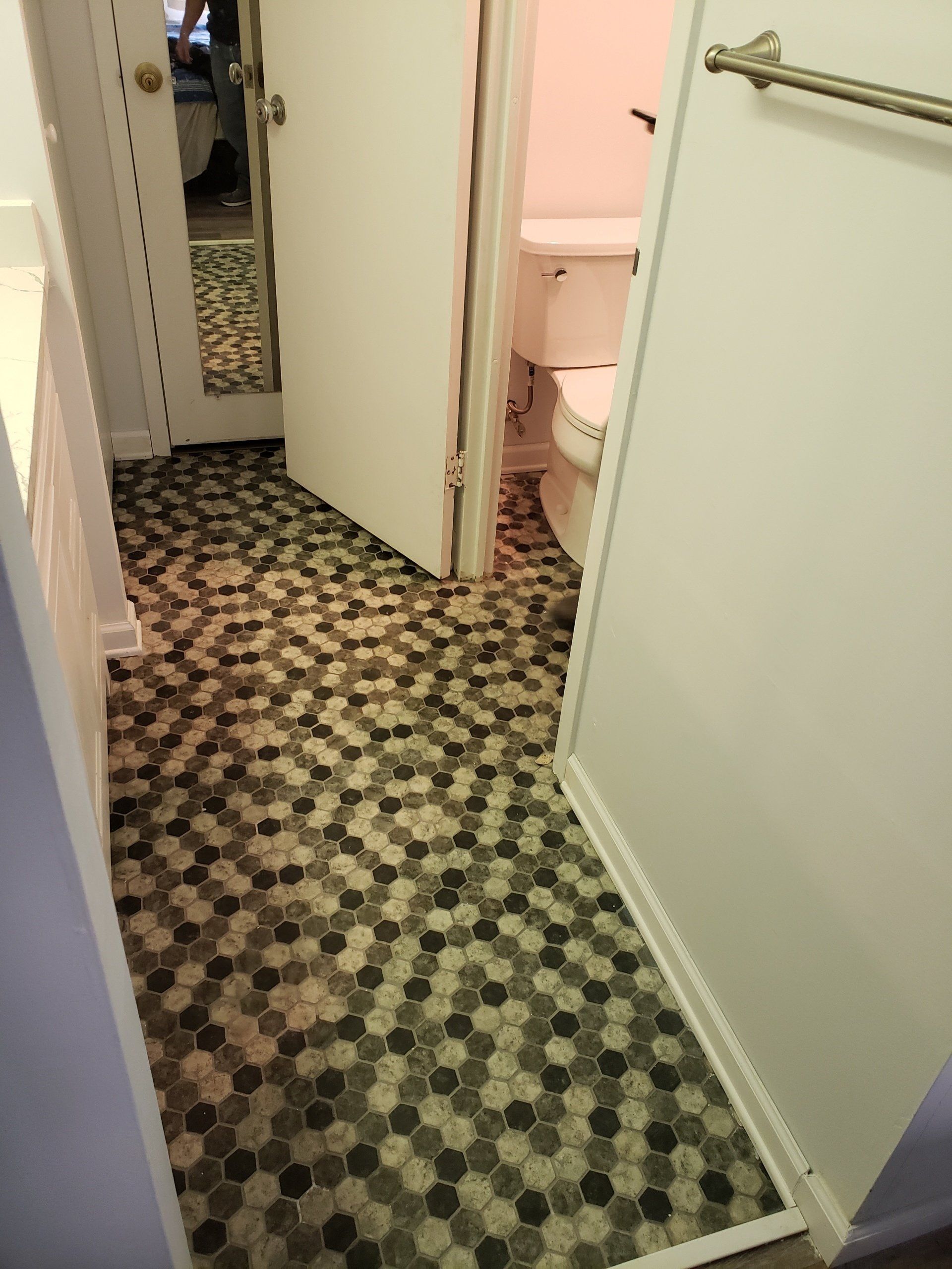 Jenkintown condo bathroom remodel close up of mosaic floor tiles.