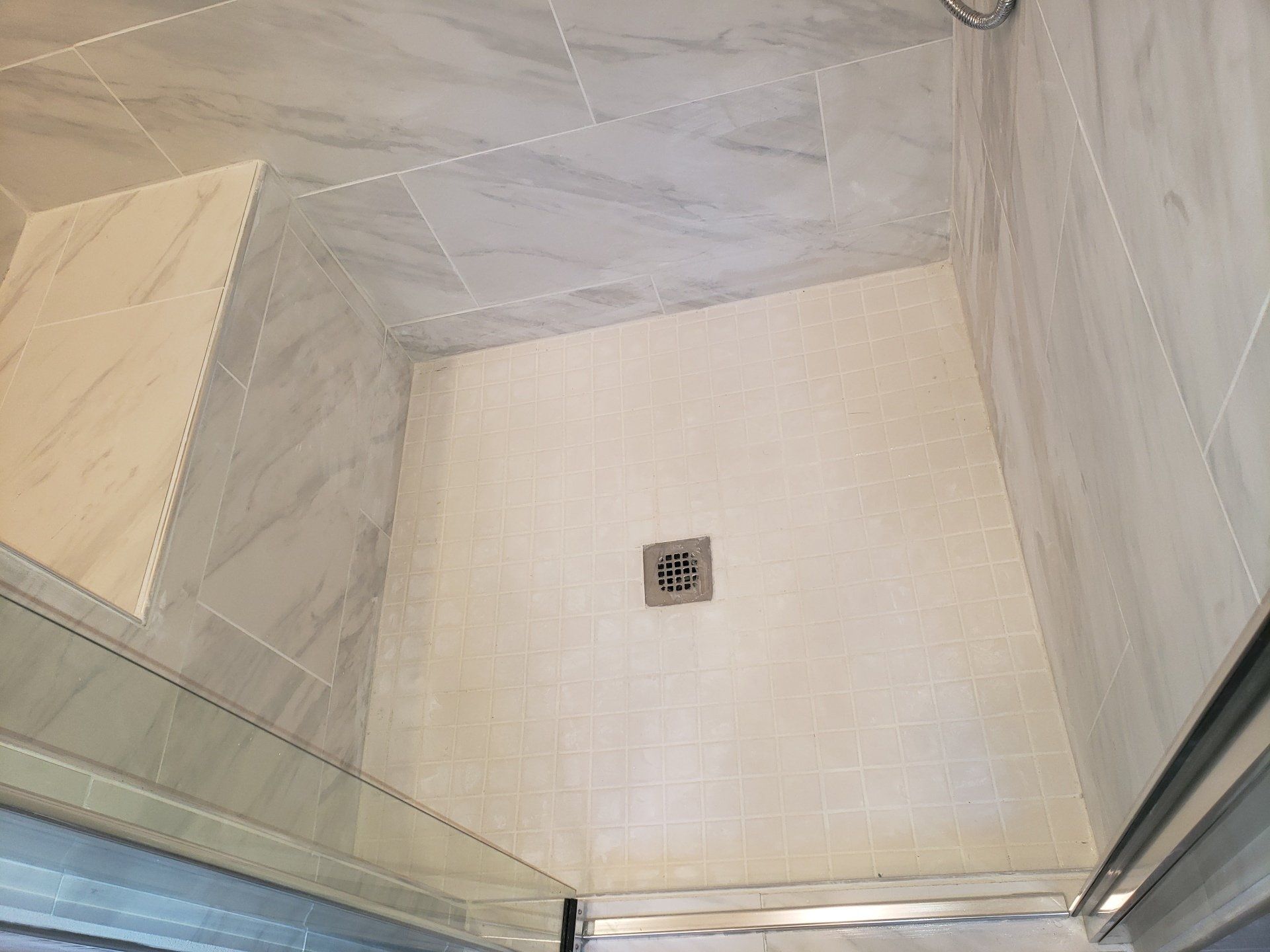 After photo of Elkins Park Shower expansion and remodel close up of mosaic shower floor tile