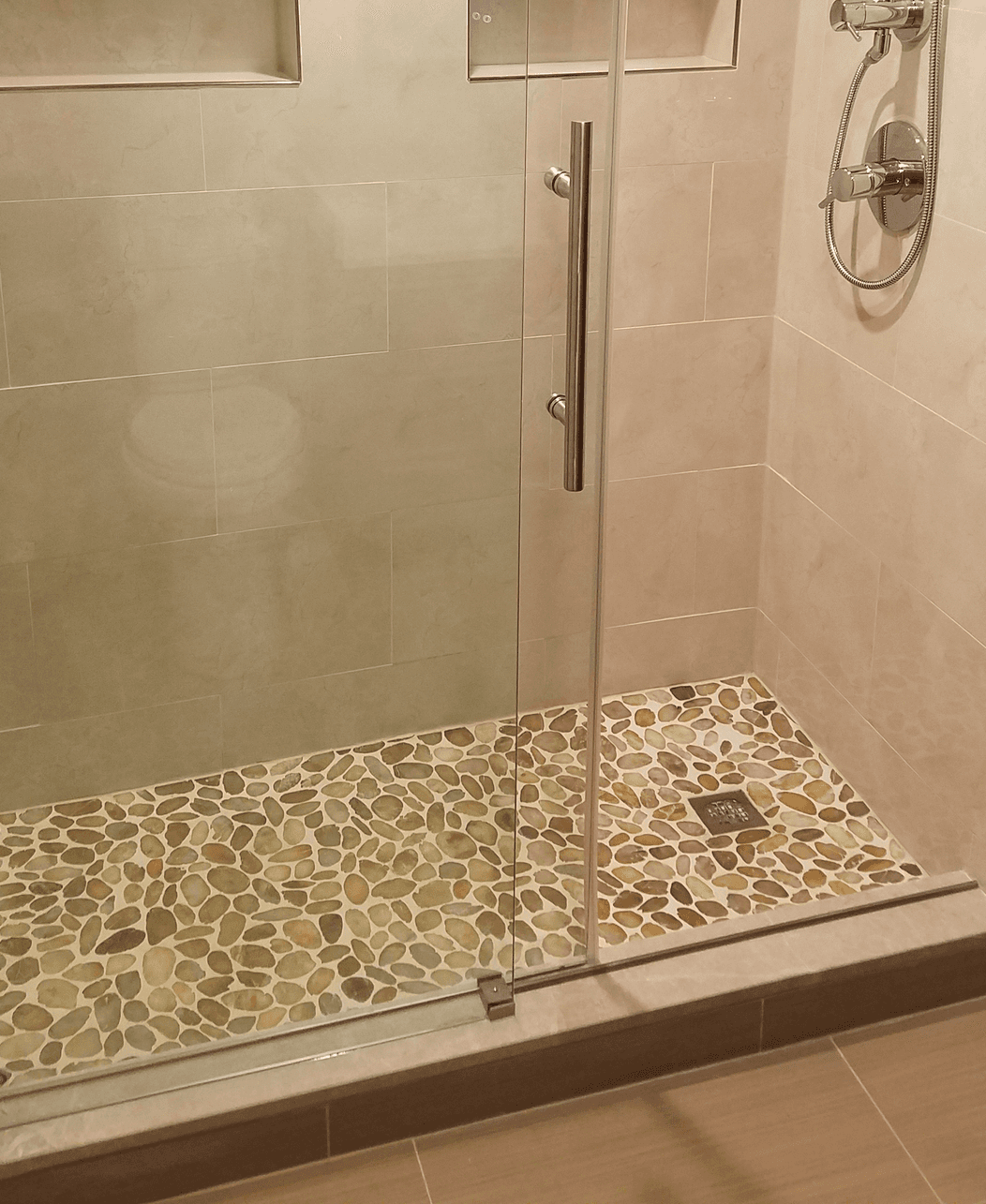 pebble shower floor closeup with shower niches bathroom remodel Abington Montgomery County