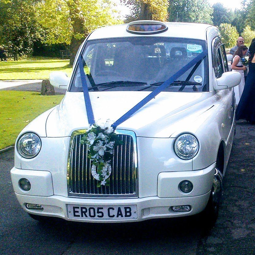 White Wedding Taxi with Navy Blue Wedding Ribbon