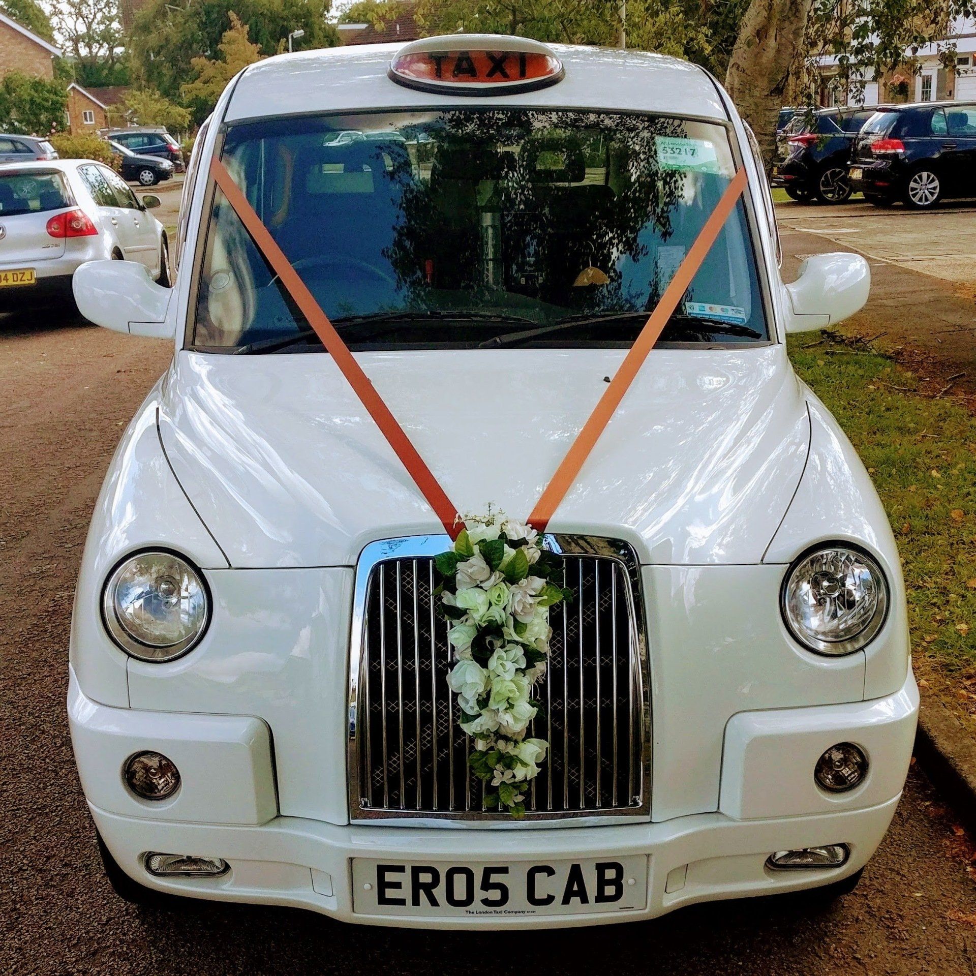 White Wedding Taxi with Bronze Wedding Ribbon