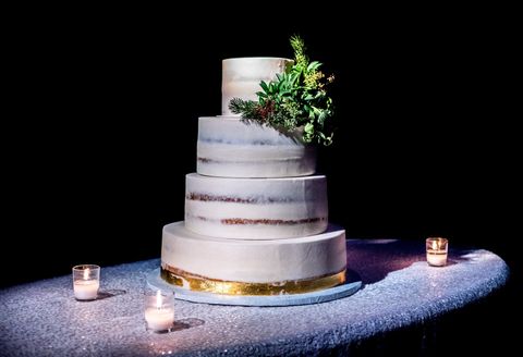 4 tier naked wedding cake with fern bouquet