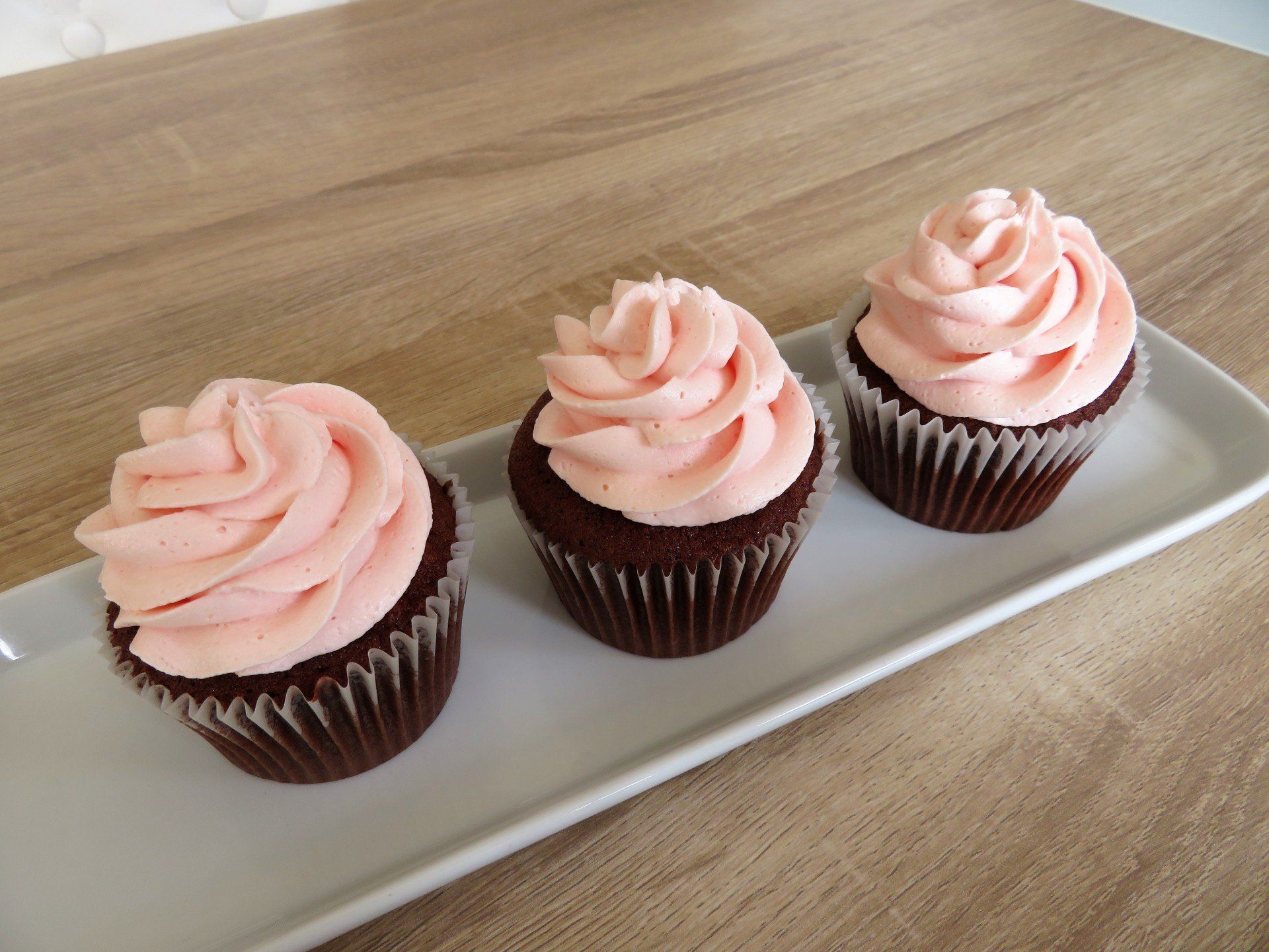 Chocolate cupcakes with pink buttercream swirls