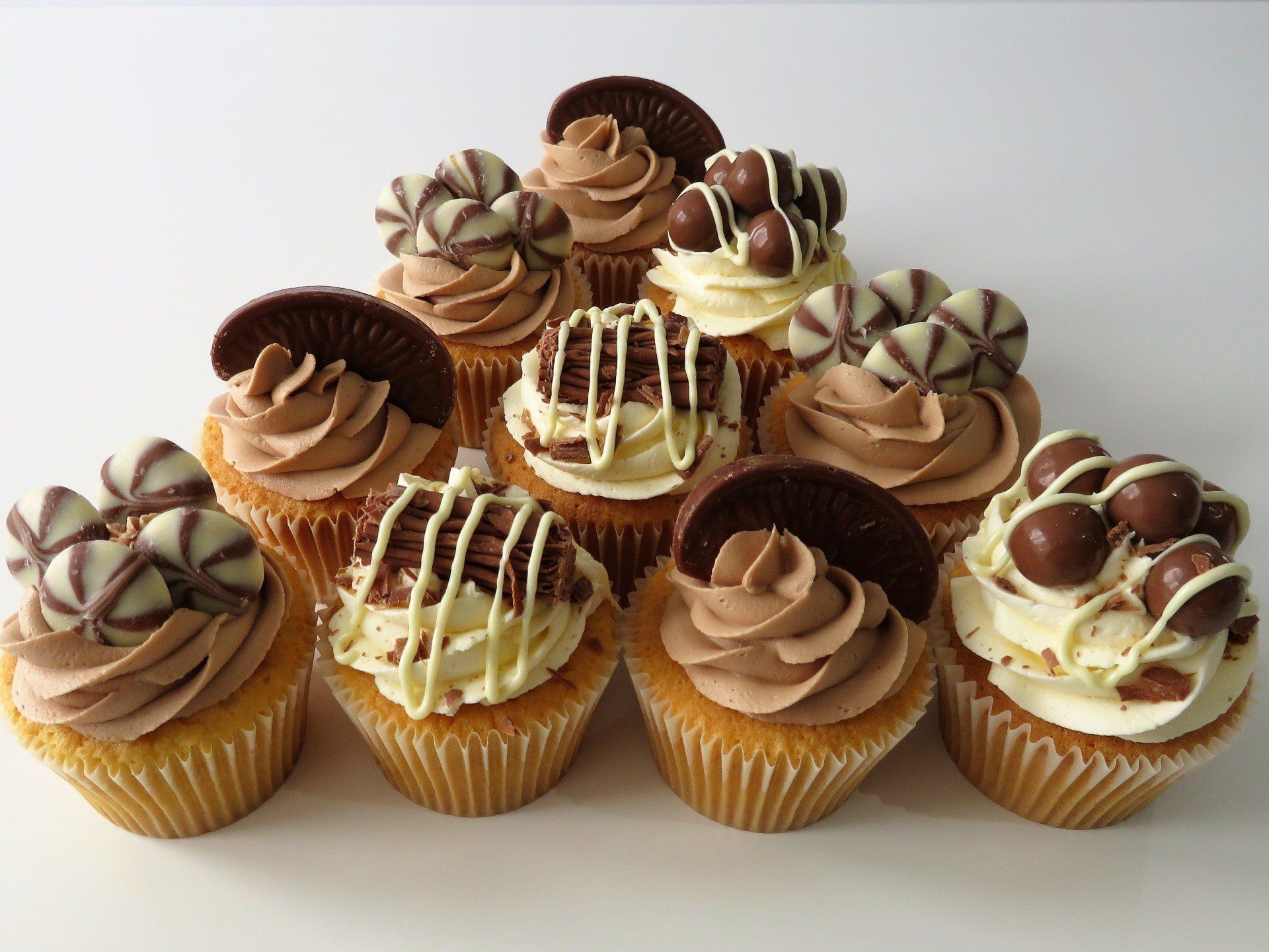 Chocolate topped vanilla buttercream cupcakes