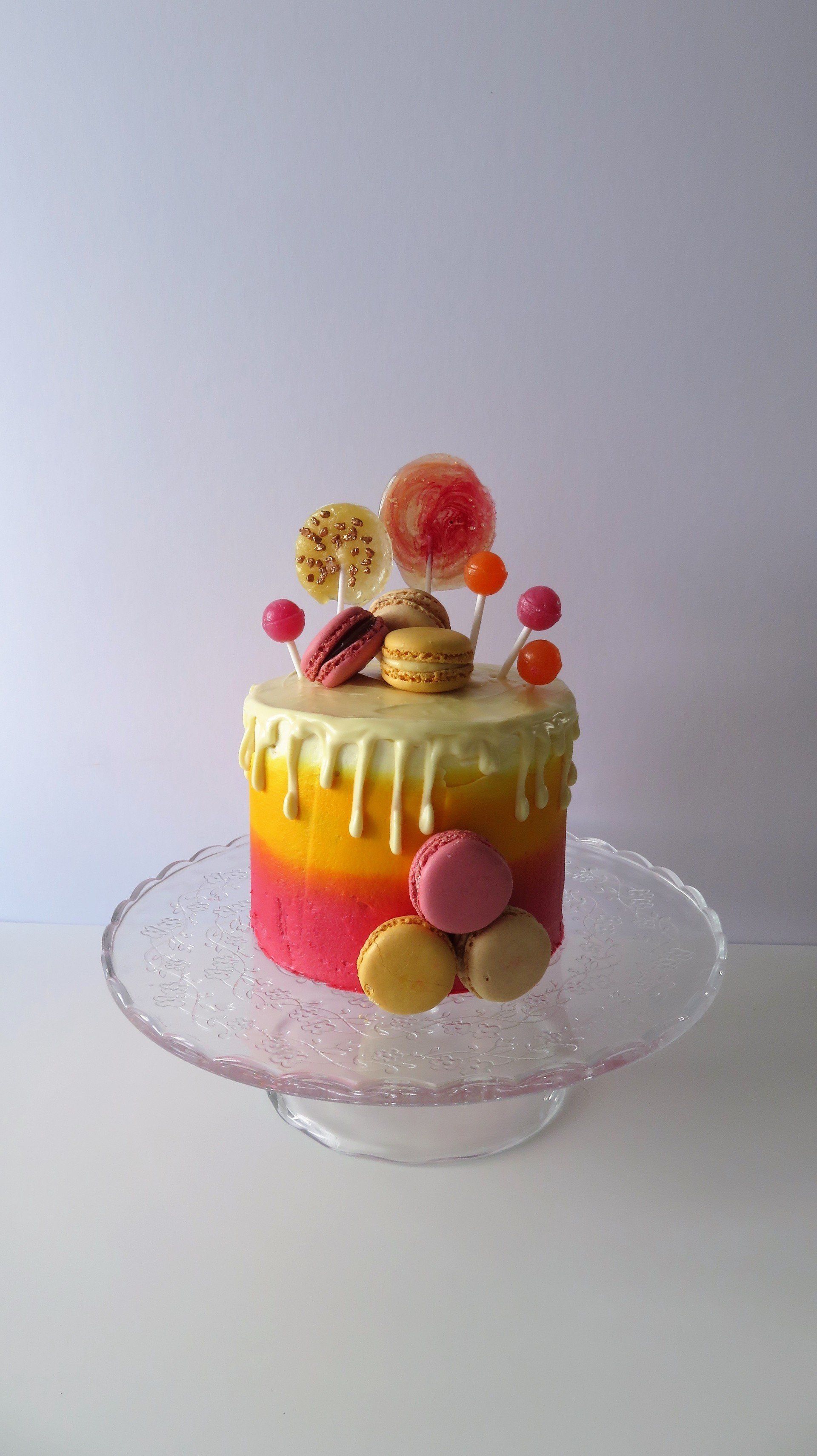 Colourful buttercream macaroon and lollypop birthday cake