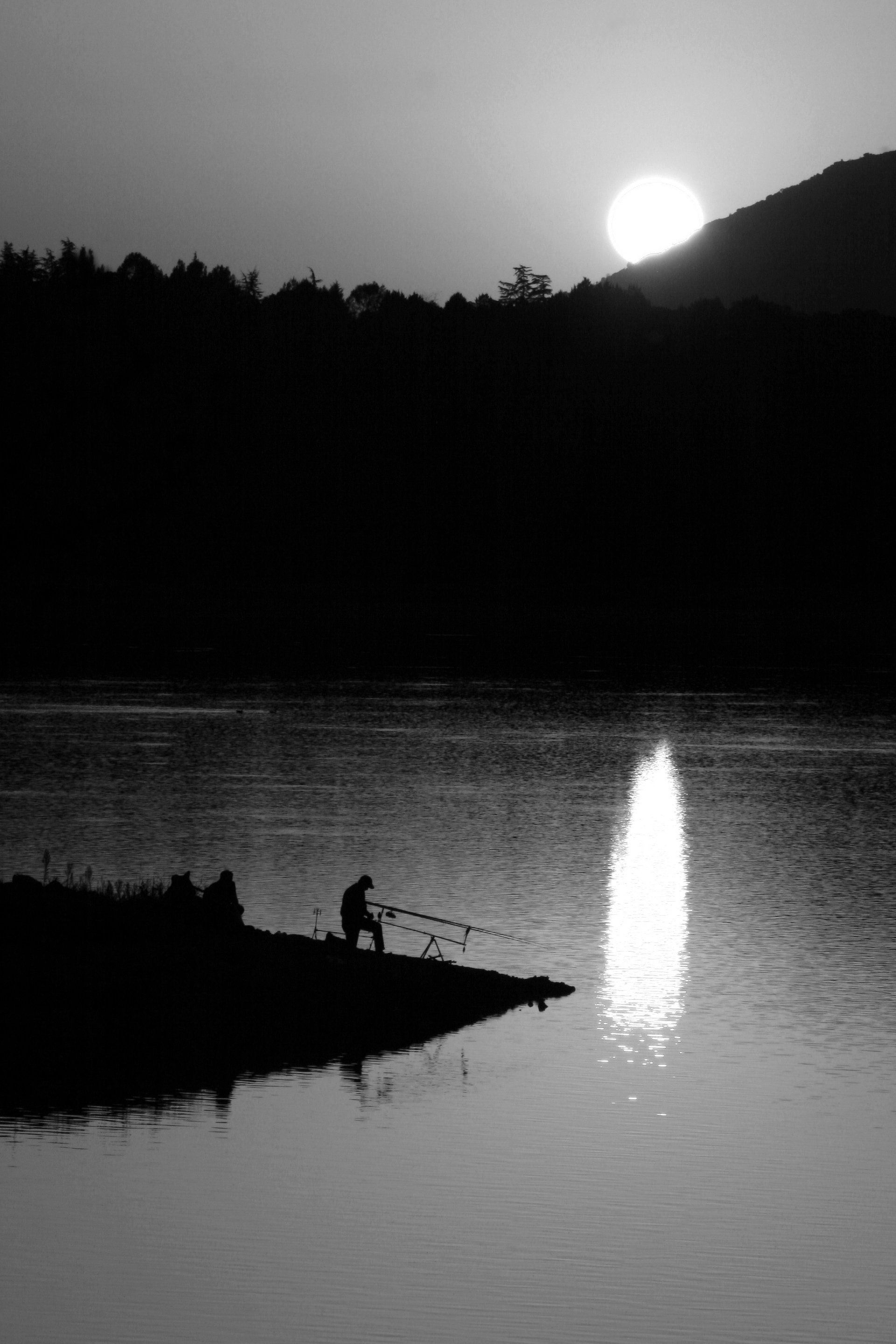 pescador puesta sol