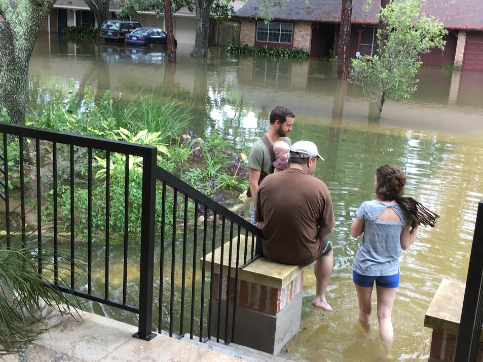 Steve's daughter and her family wait out the storm on the front steps of the Indigo Street house, along with one of Linda's neighbors. The water was about a foot and a half deep.