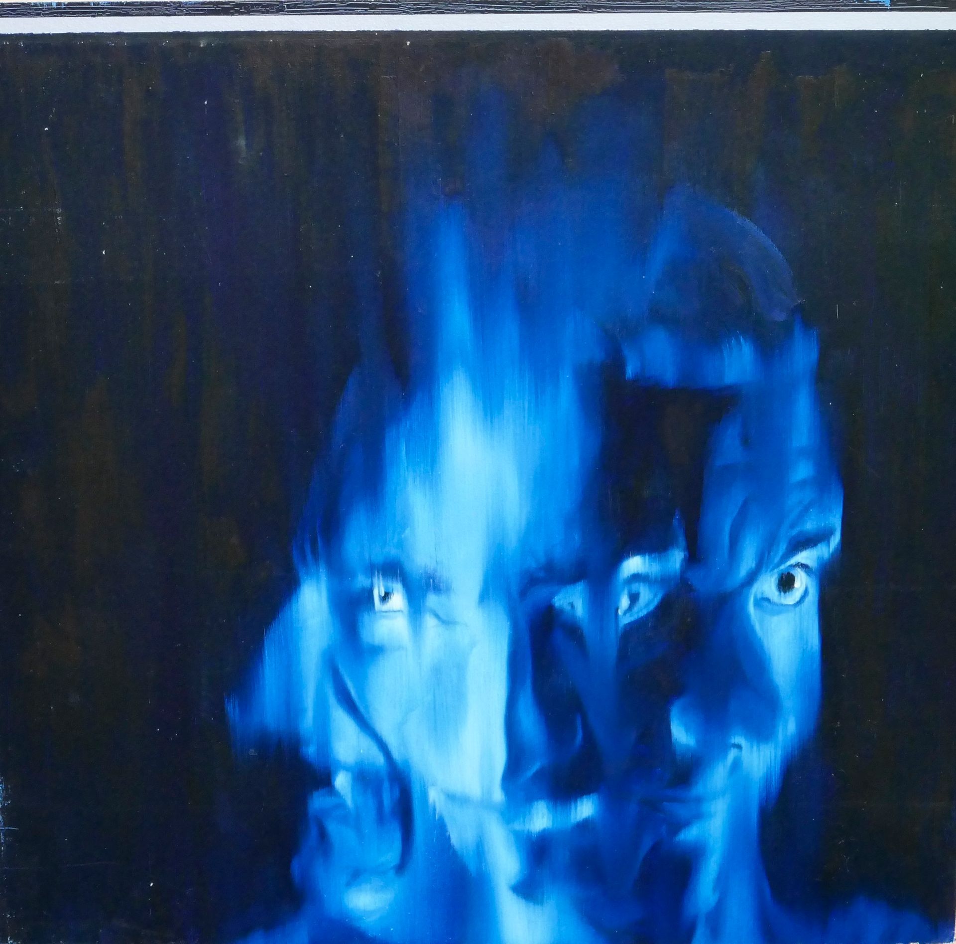 verschachteltes portrait aus drei koepfen, die boese grinsend und starren, 