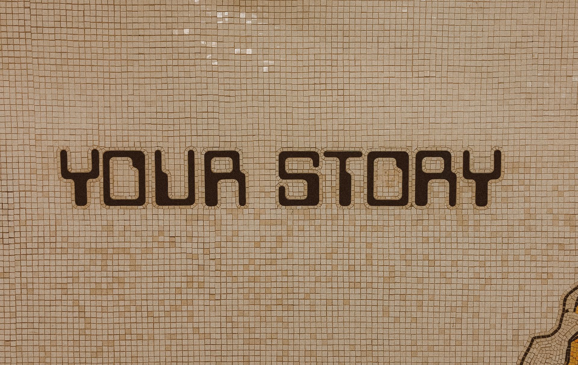 Mosaikkacheln mit der Aufschrift YOUR STORY