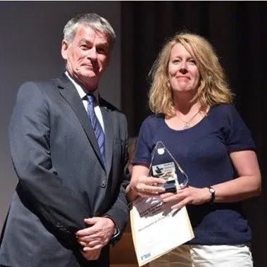 Kathryn Coleman receiving a prize from the Institute of Education