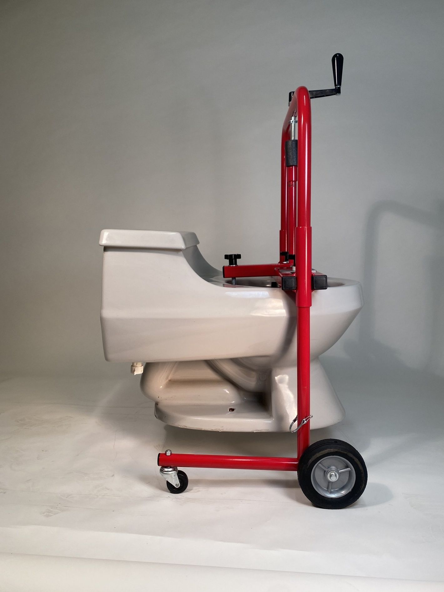 Toilet Kart, a plumbers tool to lift, set & move a toilet.