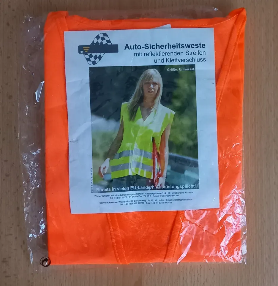 Sicherheitsweste Warnweste Orange Vorderseite zeigt eine Frau mit Sicherheitsweste  Orange an