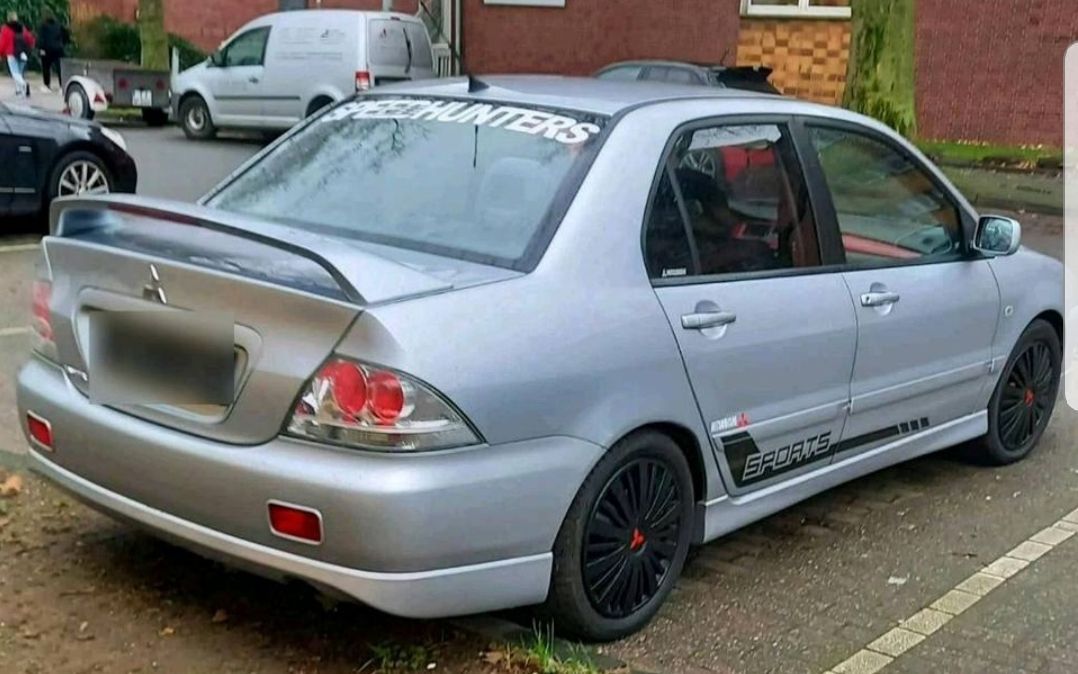 Mitsubishi Lancer-Baujahr 2008-Silber-Heck-Beifahrerseite-135PS