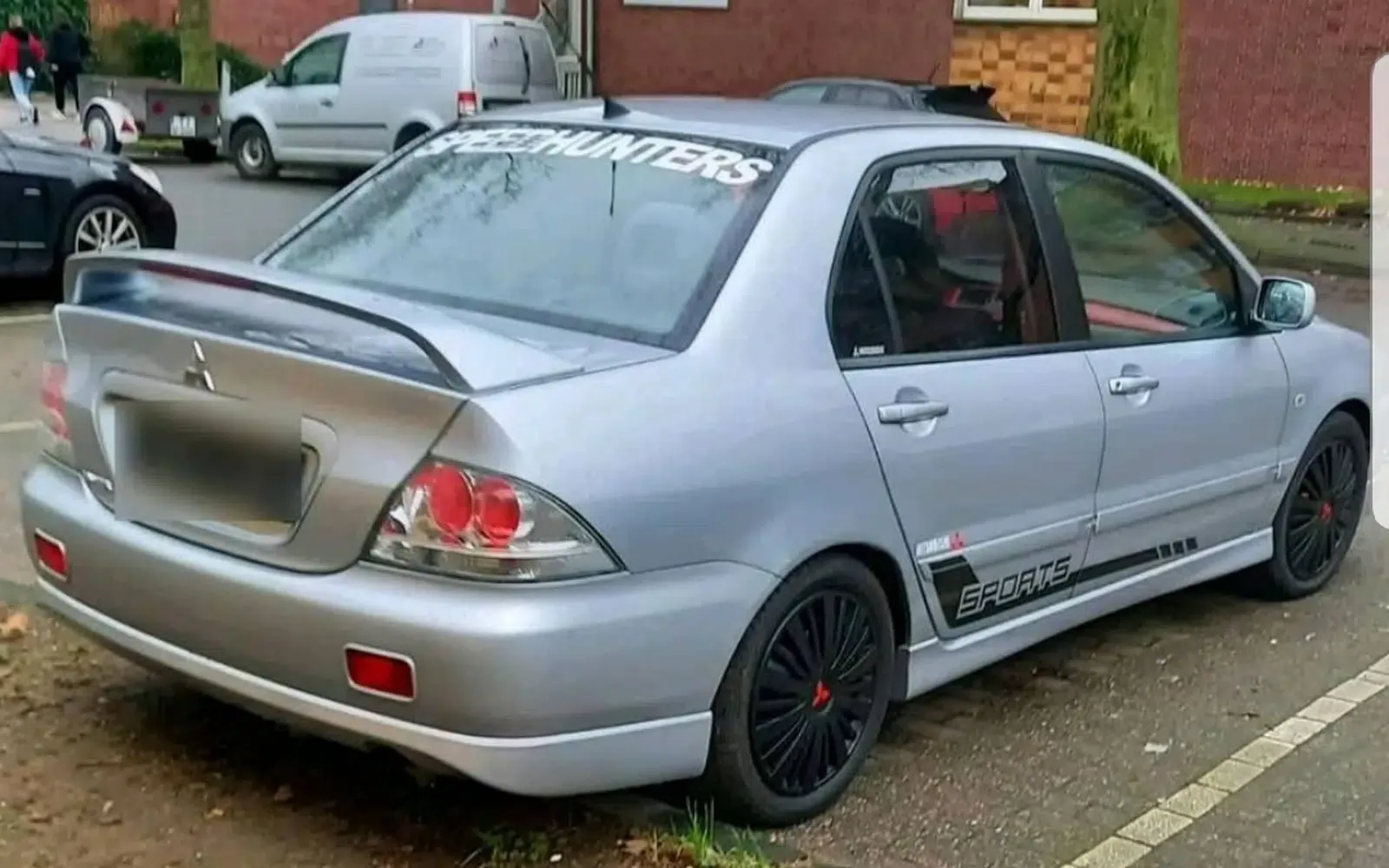 Mitsubishi Lancer-Baujahr 2008-Silber-Heck-Beifahrerseite-135PS