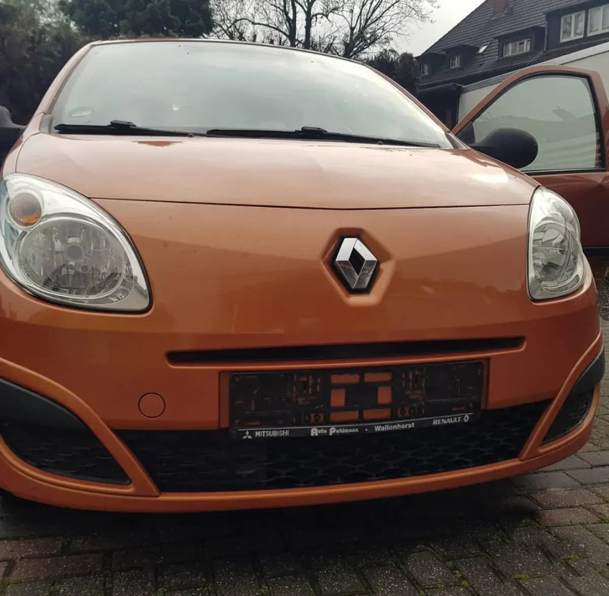 Renault Twingo 2009 Orange Front Scheinwerfer Fahrer Tür offen 