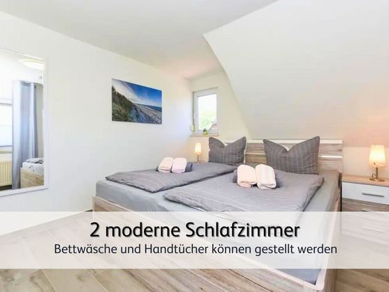 Das moderne Zweitschlafzimmer der FeWo Robbe 2 in Bensersiel mit gemütlichem Doppelbett