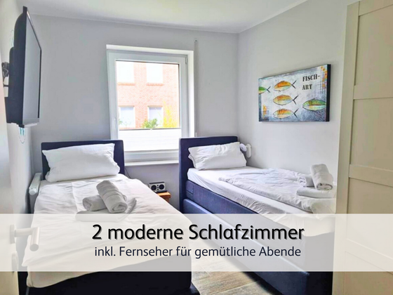 helles und modernes Zweitschlafzimmer der Ferienwohnung StrandART in Norddeich mit zwei gemütlichen Einzel-Boxspringbetten und Fernseher