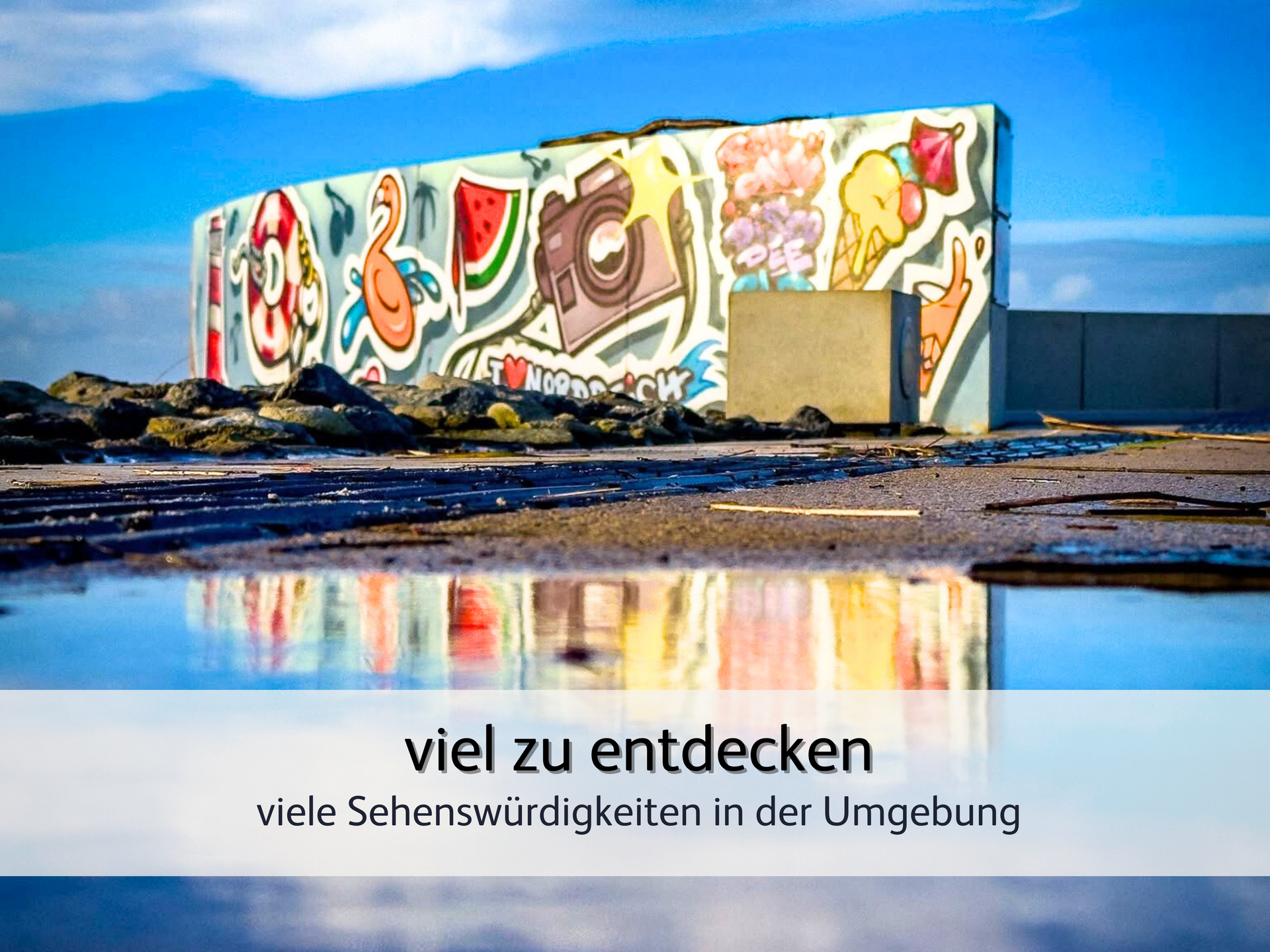 Kunterbunte Wand als Foto-Hotspot an der Hafenpromenade von Norddeich