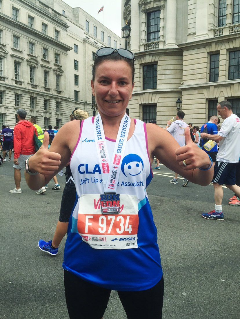 Sam Zreik, after the 2016 London Vitality 10k run. Thumbs up, and wearing a medal.