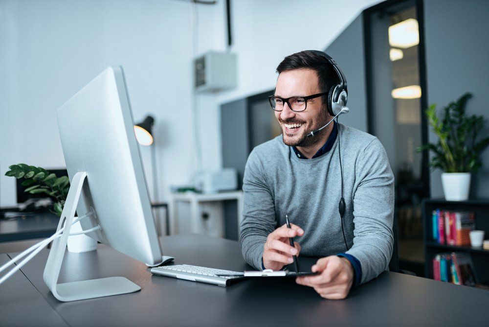 Man working from home with a headset on