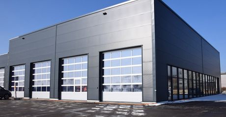 company hall with four sliding doors with windows