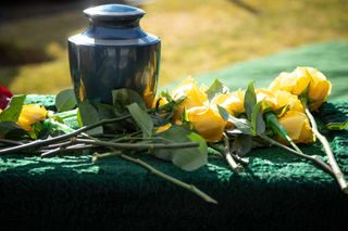 Urn & Yellow Roses