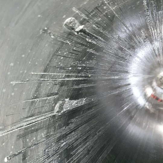 large damaged hydraulic cylinder tube