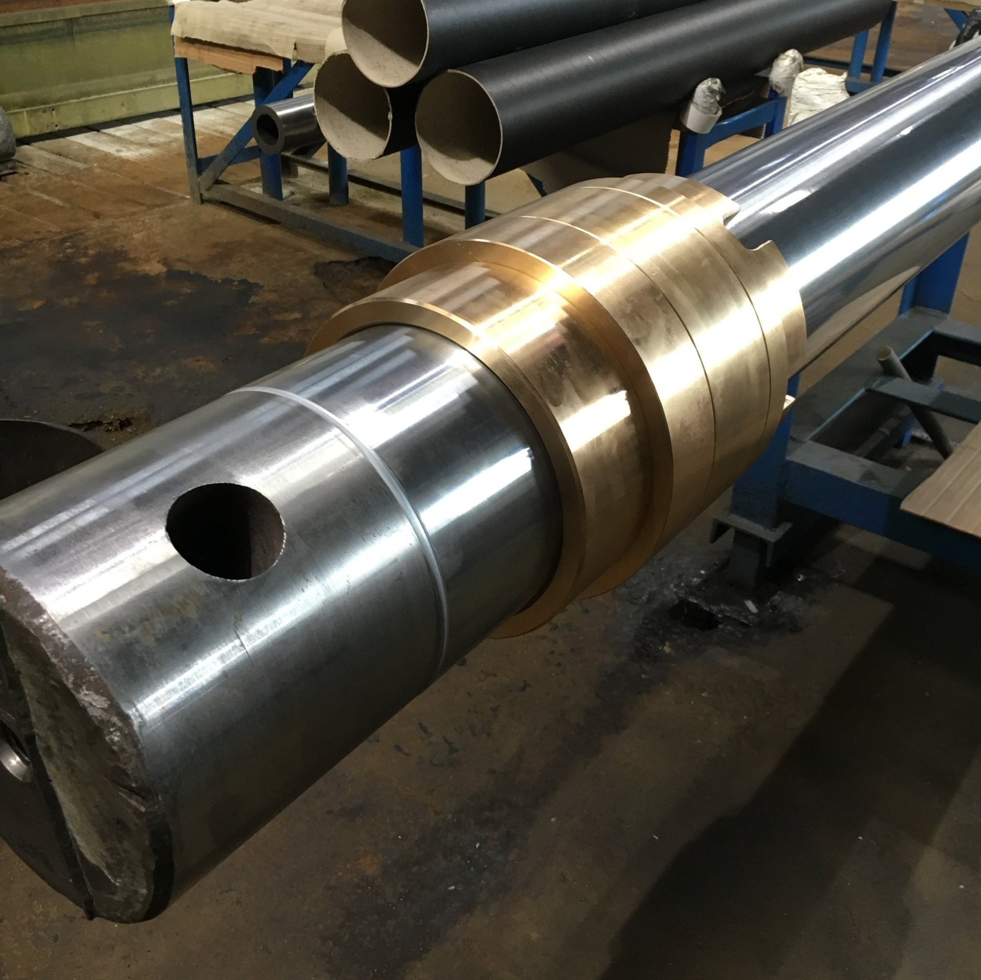 Large chrome plated piston rod with bronze gland