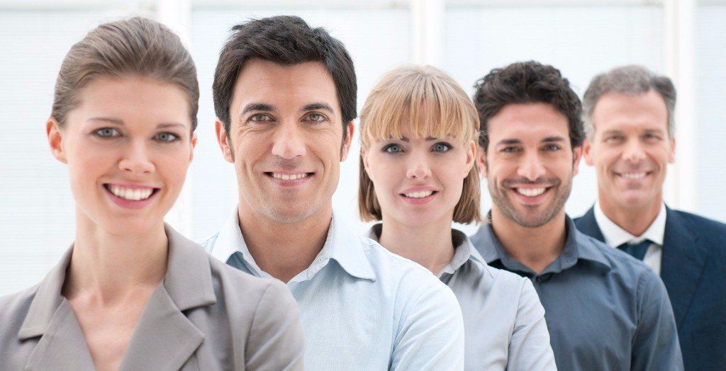 Group of smiling people in professional dress