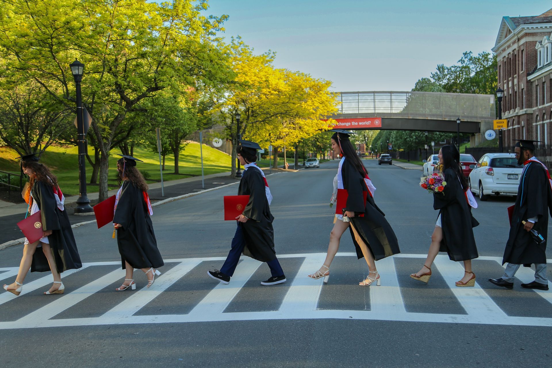 Group cap and gown portraits during sunset
