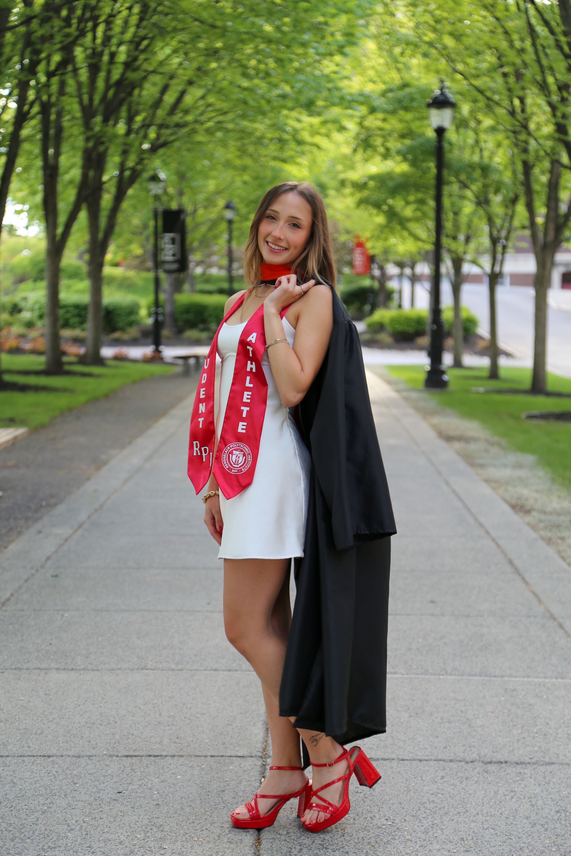 Natural cap and gown graduation session during sunset