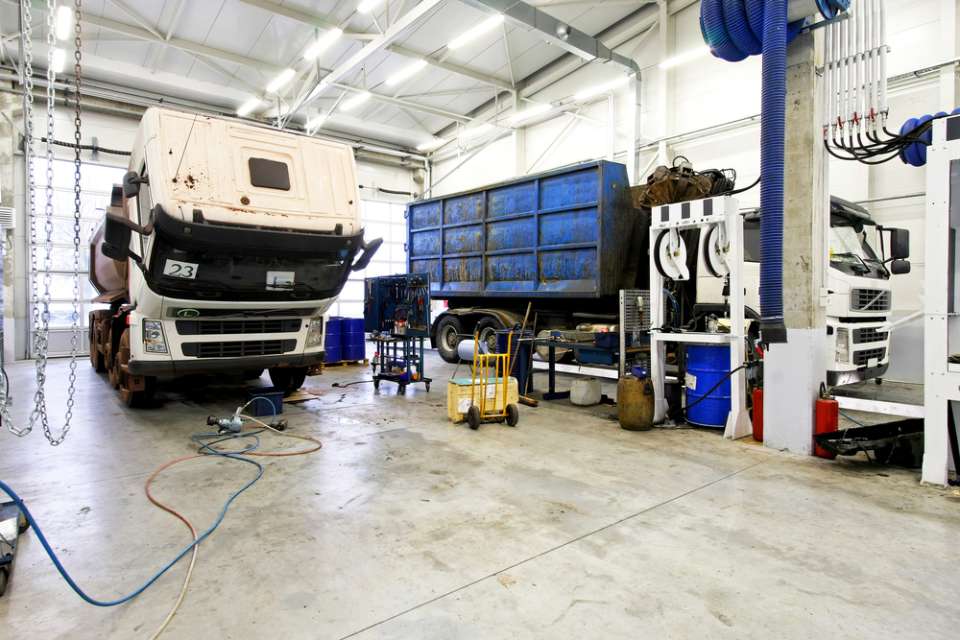 mechanic working on large vehicle