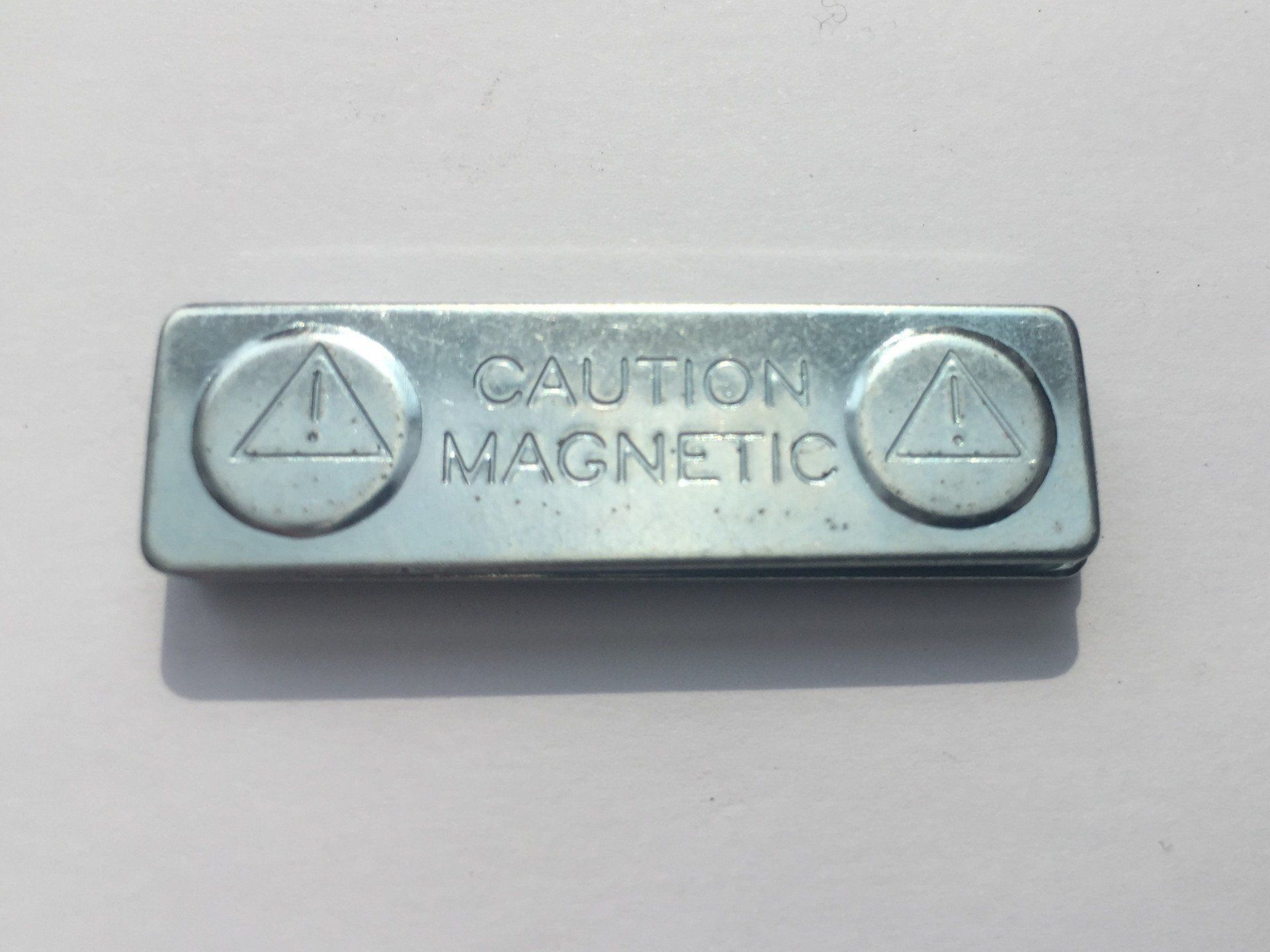 Magnetic fastening for badge